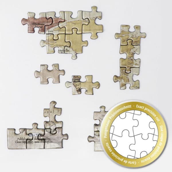 Detailansicht auf Puzzle-Teile mit Siegel: „Passgenauer Präzisionsschnitt“